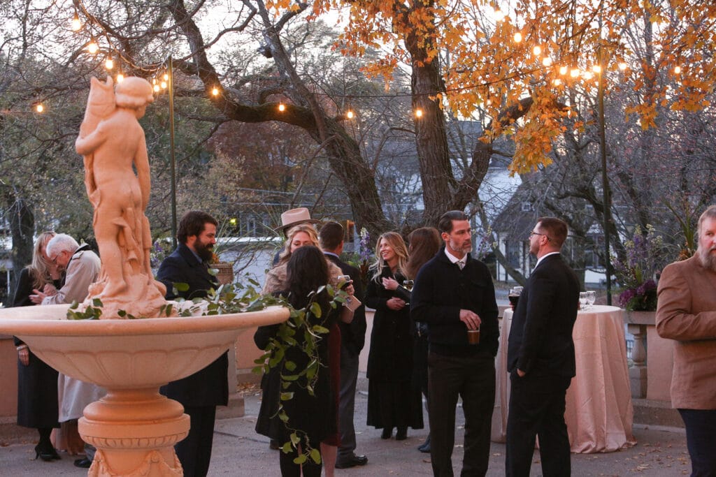 guests mingling during fall cocktail hour at fowler house mansion