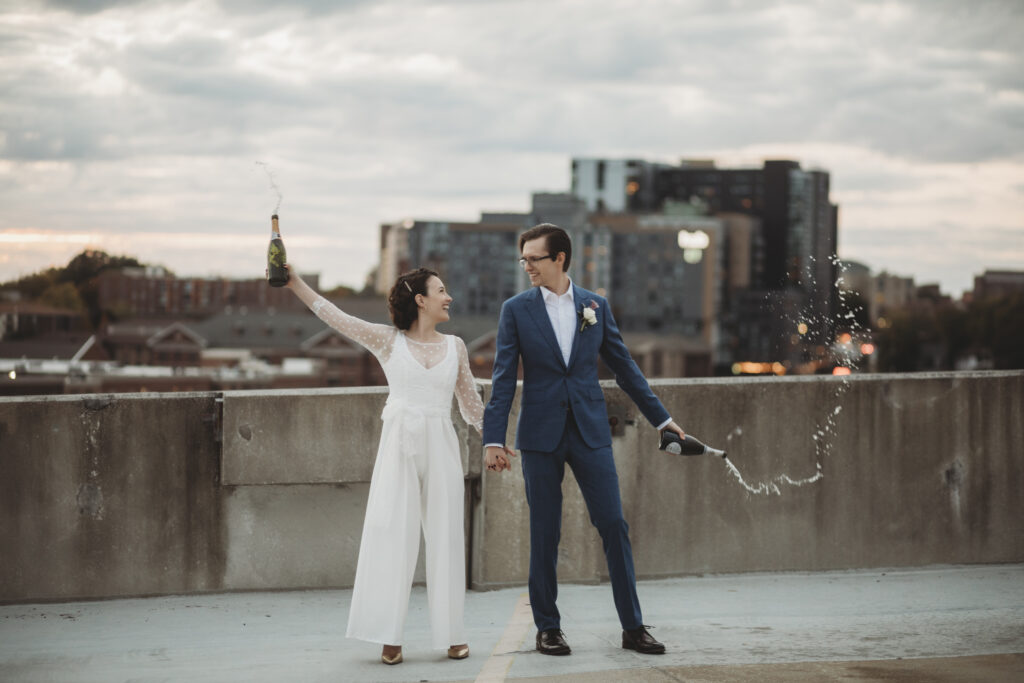 bride and groom celebrating their modern midwest elopement with champagne